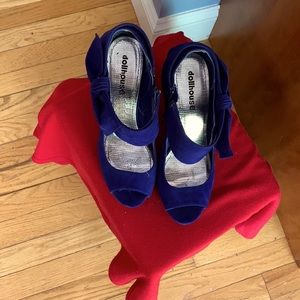 Royal blue high heels with a bow side zippers on the side they are suede shoes